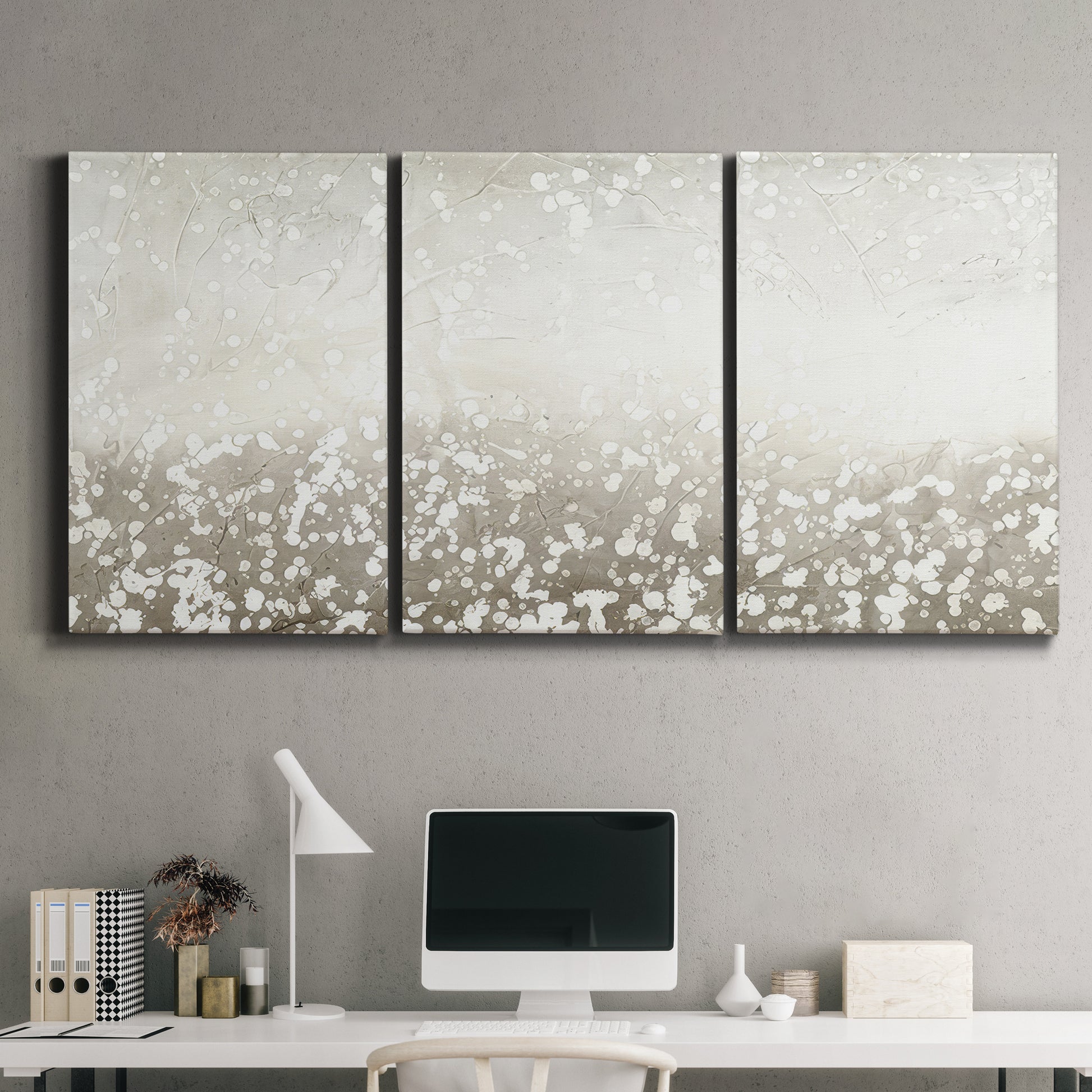 Three-panel canvas wall art featuring dark textured abstract mist, displayed above a desk in a home office.