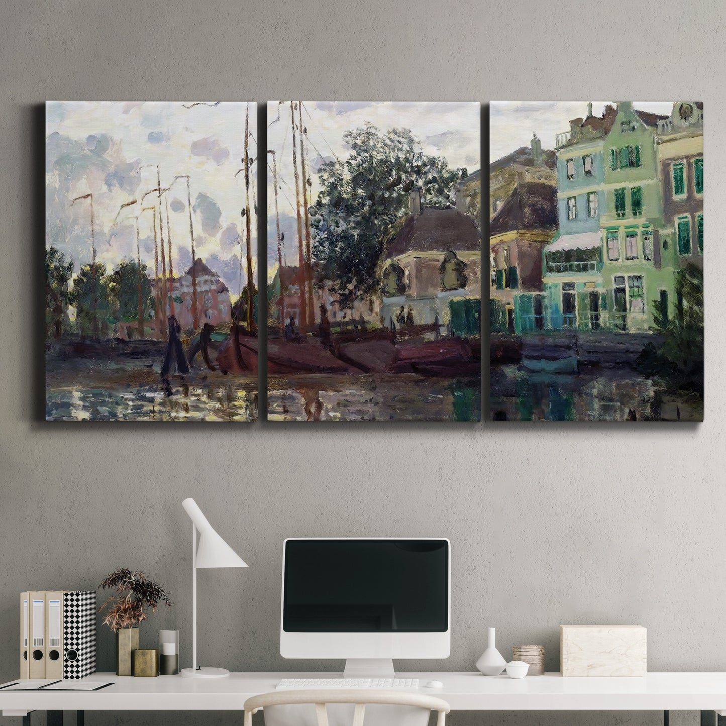 Three-panel canvas wall art featuring riverside town dike at evening, displayed above a desk in a home office.