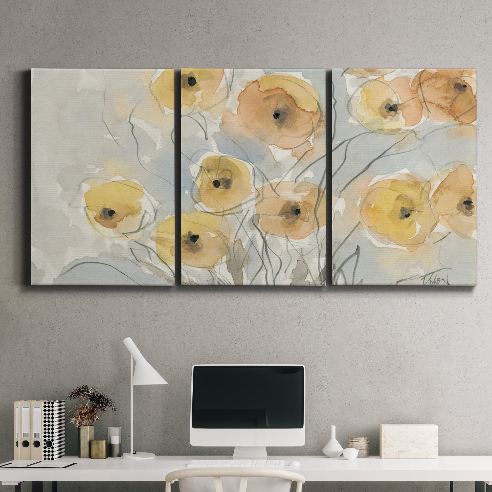 Three-panel canvas wall art featuring minimalist poppies at sunset, displayed above a desk in a home office.