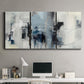Three-panel canvas wall art featuring cool abstract winter color wash, displayed above a desk in a home office.