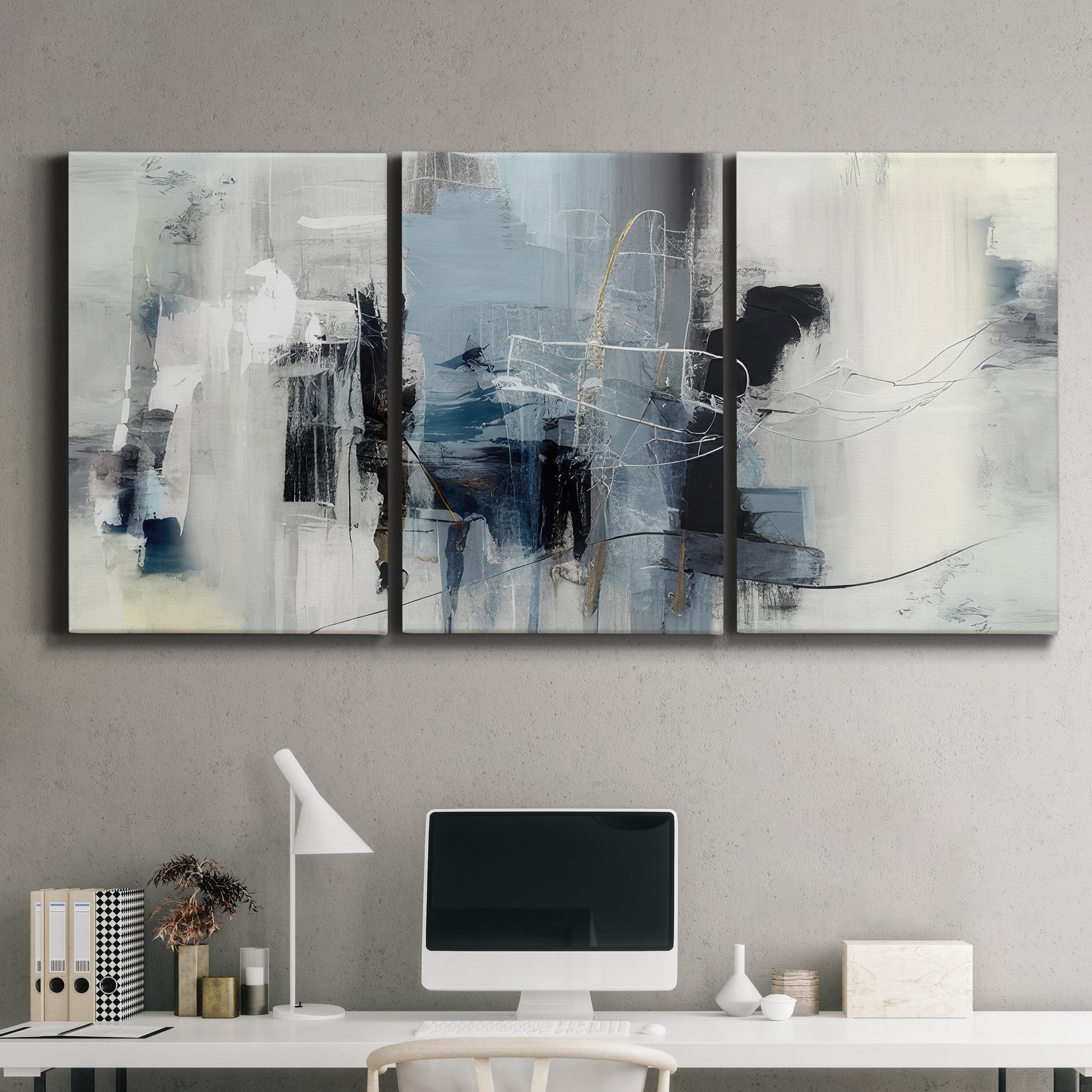 Three-panel canvas wall art featuring cool abstract winter color wash, displayed above a desk in a home office.