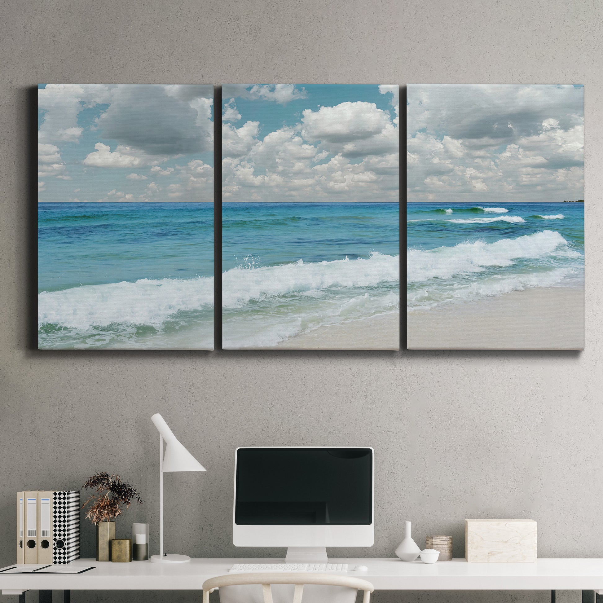 Three-panel canvas wall art featuring tropical beach scene with turquoise water, displayed above a desk in a home office.