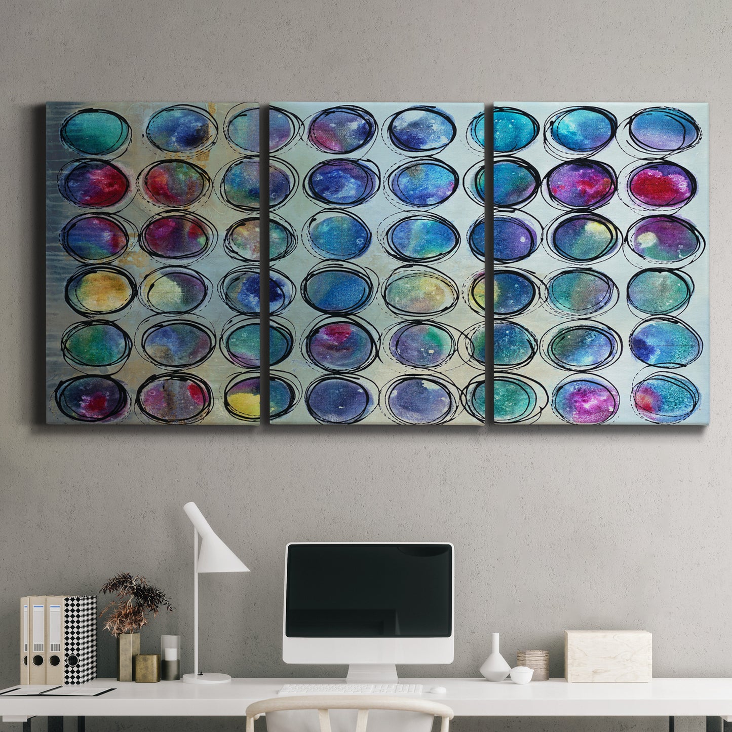 Three-panel canvas wall art featuring contrasting geometric abstract variations, displayed above a desk in a home office.