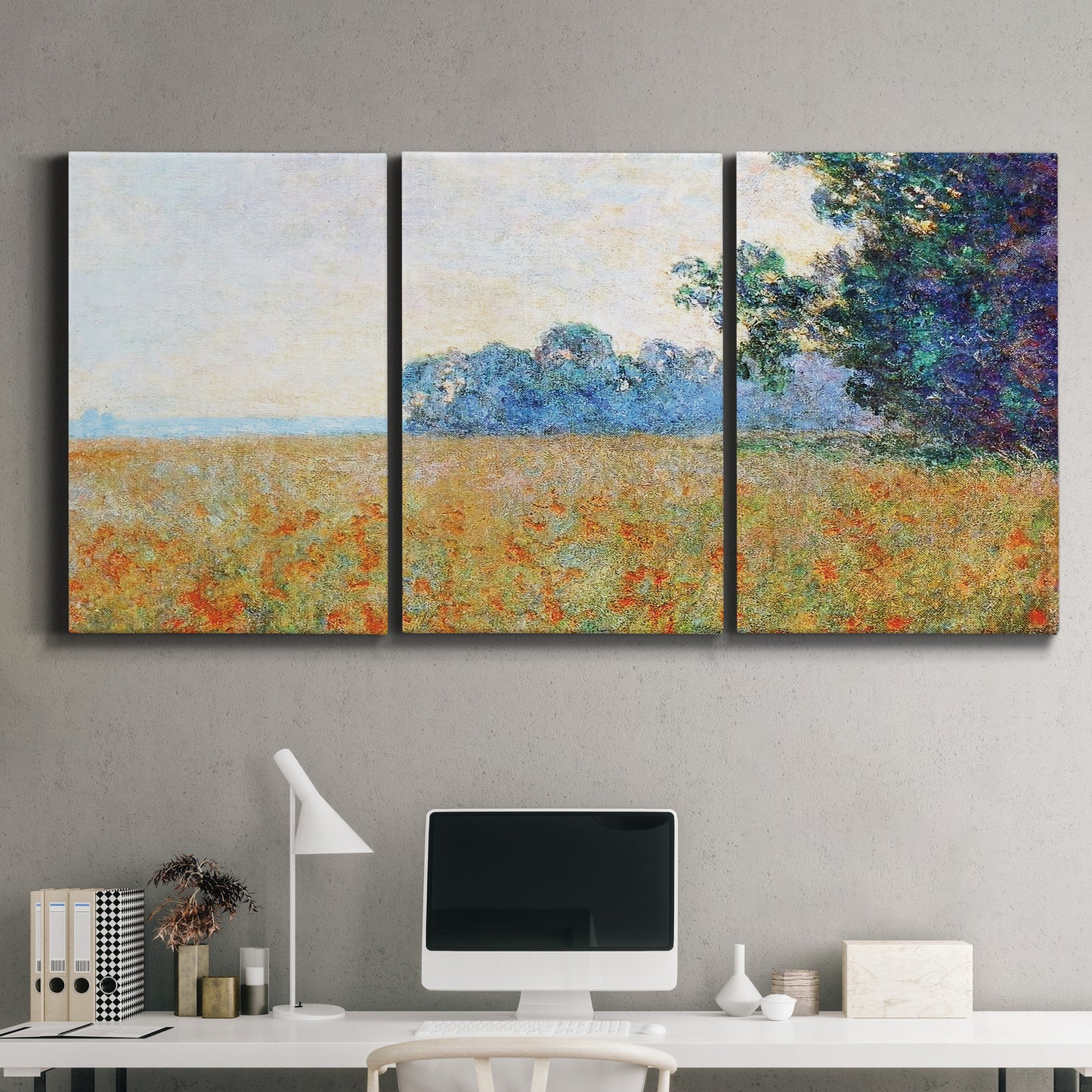 Three-panel canvas wall art featuring oat field with scattered poppies, displayed above a desk in a home office.