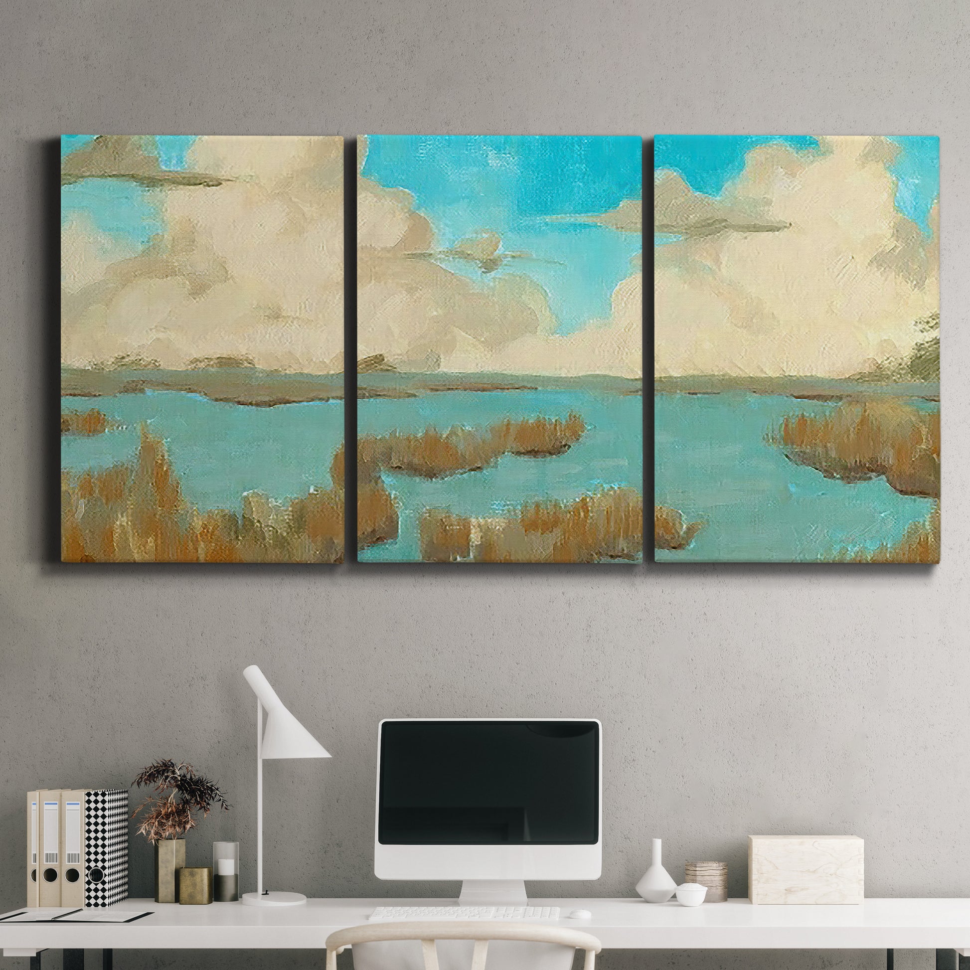 Three-panel canvas wall art featuring abstract pond scene with reflections, displayed above a desk in a home office.