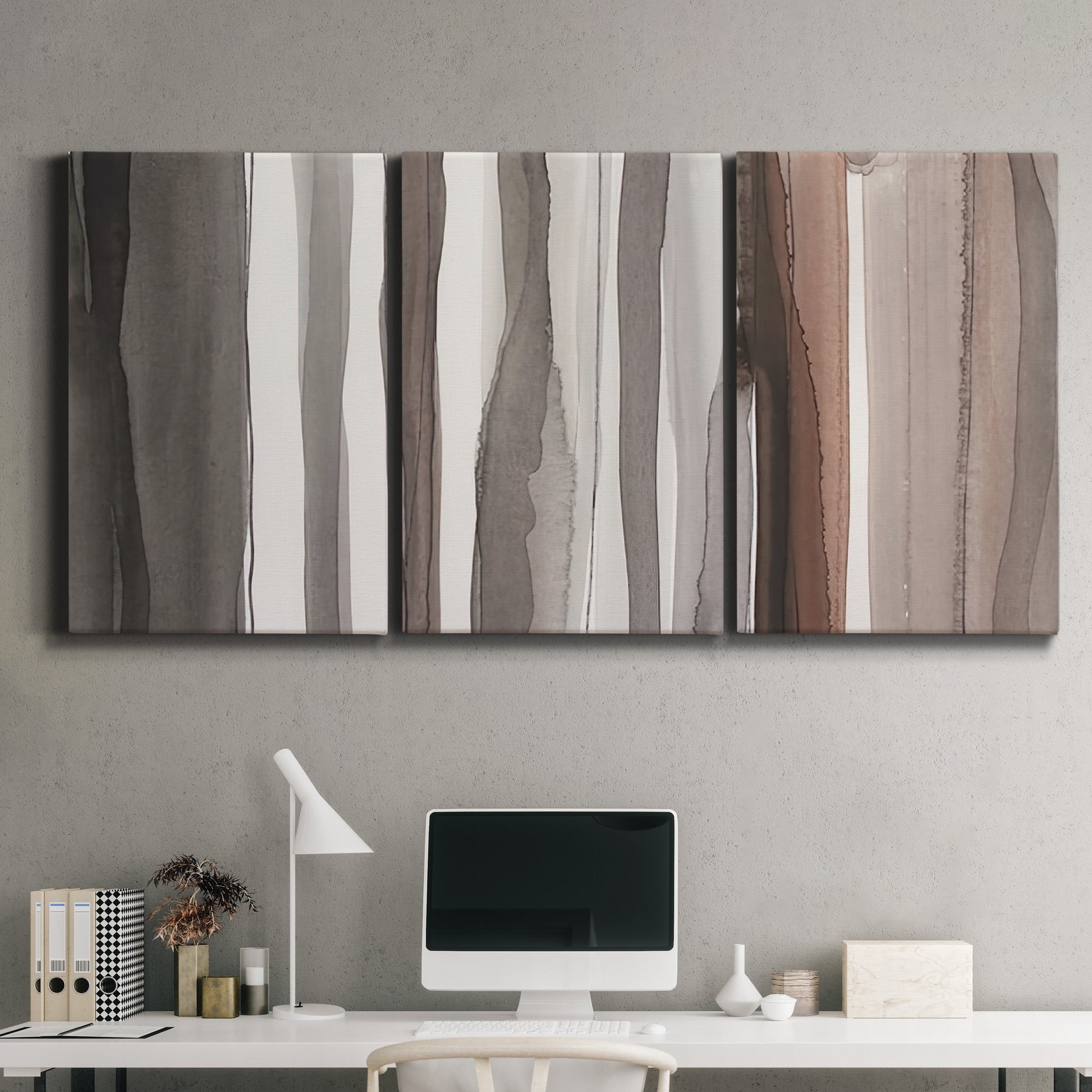 Three-panel canvas wall art featuring riverbank landscape with reflections, displayed above a desk in a home office.