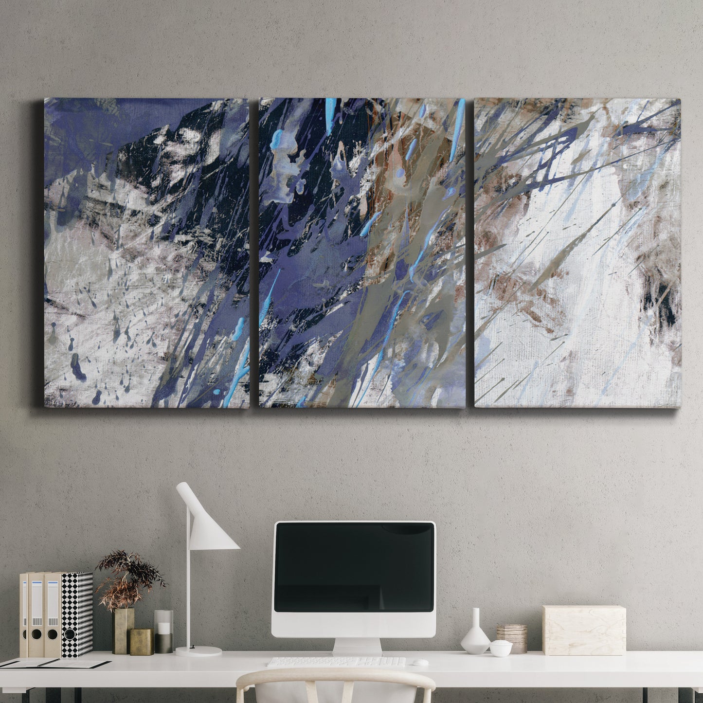 Three-panel canvas wall art featuring textured blue abstract composition, displayed above a desk in a home office.