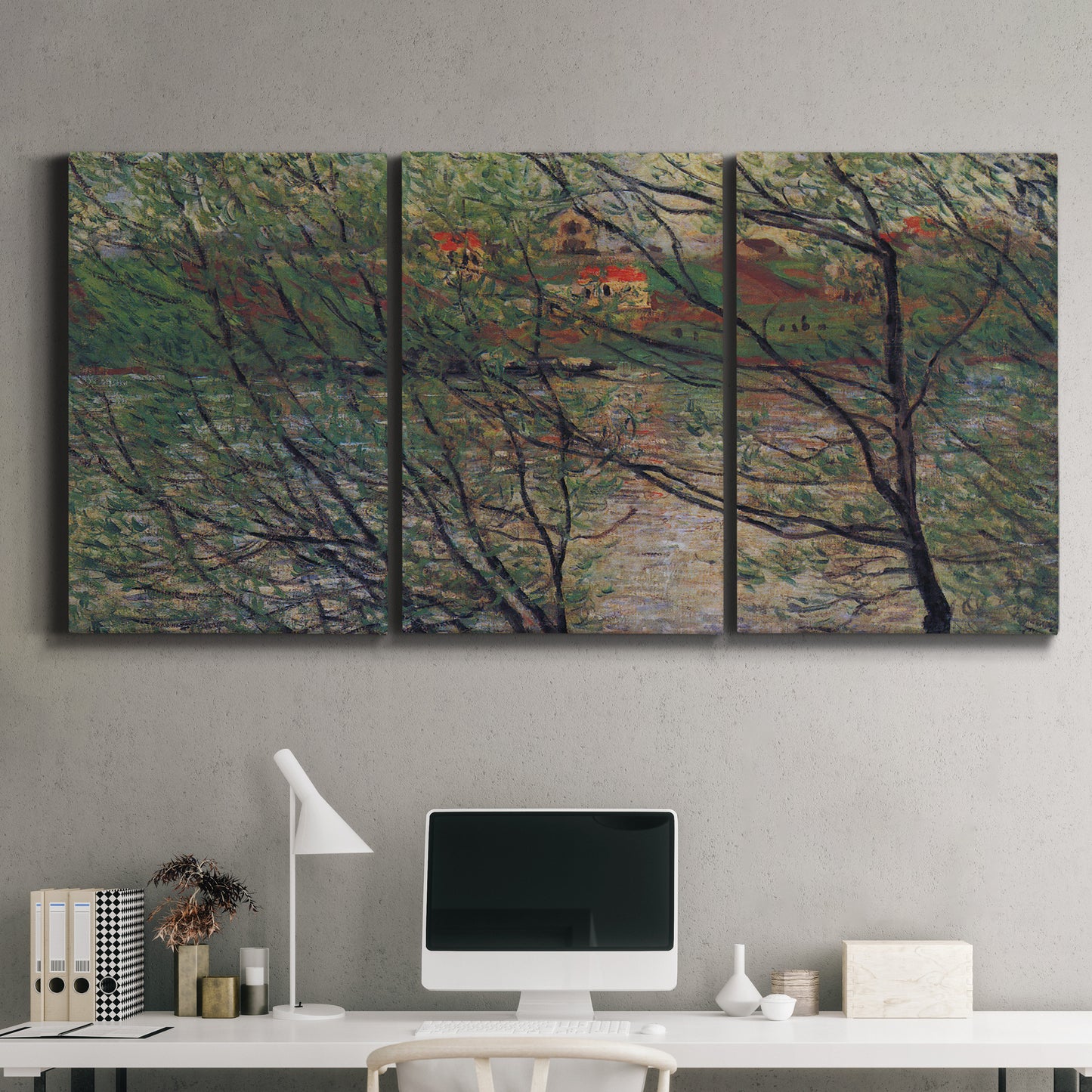 Three-panel canvas wall art featuring spring countryside with fresh foliage, displayed above a desk in a home office.