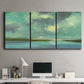 Three-panel canvas wall art featuring still lagoon water beneath open sky, displayed above a desk in a home office.