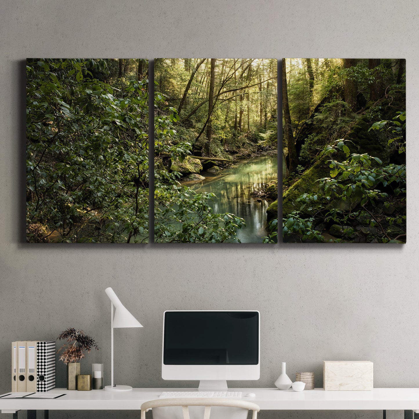 Three-panel canvas wall art featuring sun filtered woodland photograph, displayed above a desk in a home office.