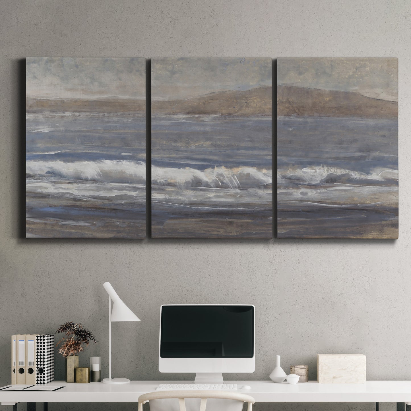 Three-panel canvas wall art featuring shoreline between land and sea, displayed above a desk in a home office.