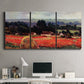 Three-panel canvas wall art featuring red poppy field near barn, displayed above a desk in a home office.