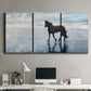 Three-panel canvas wall art featuring running horses captured mid stride, displayed above a desk in a home office.