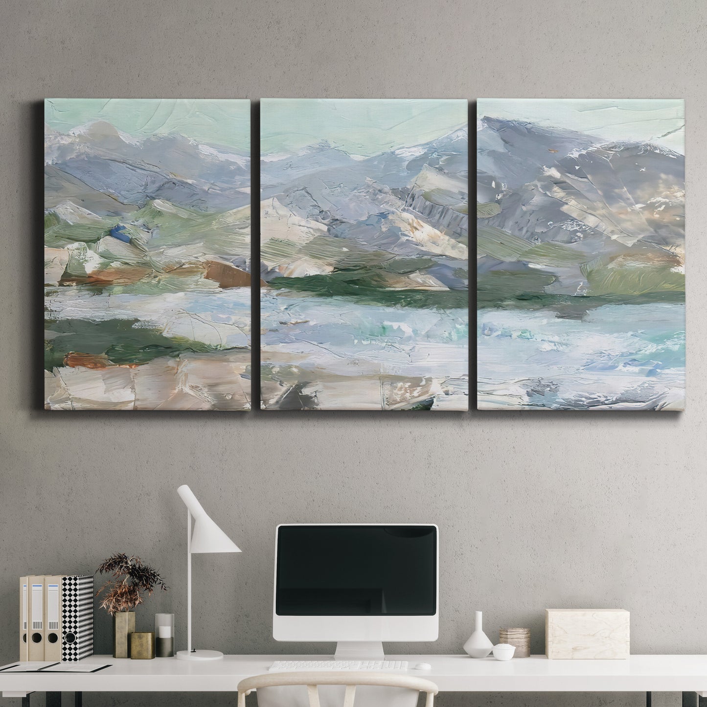 Three-panel canvas wall art featuring pastel mountain landscape view, displayed above a desk in a home office.