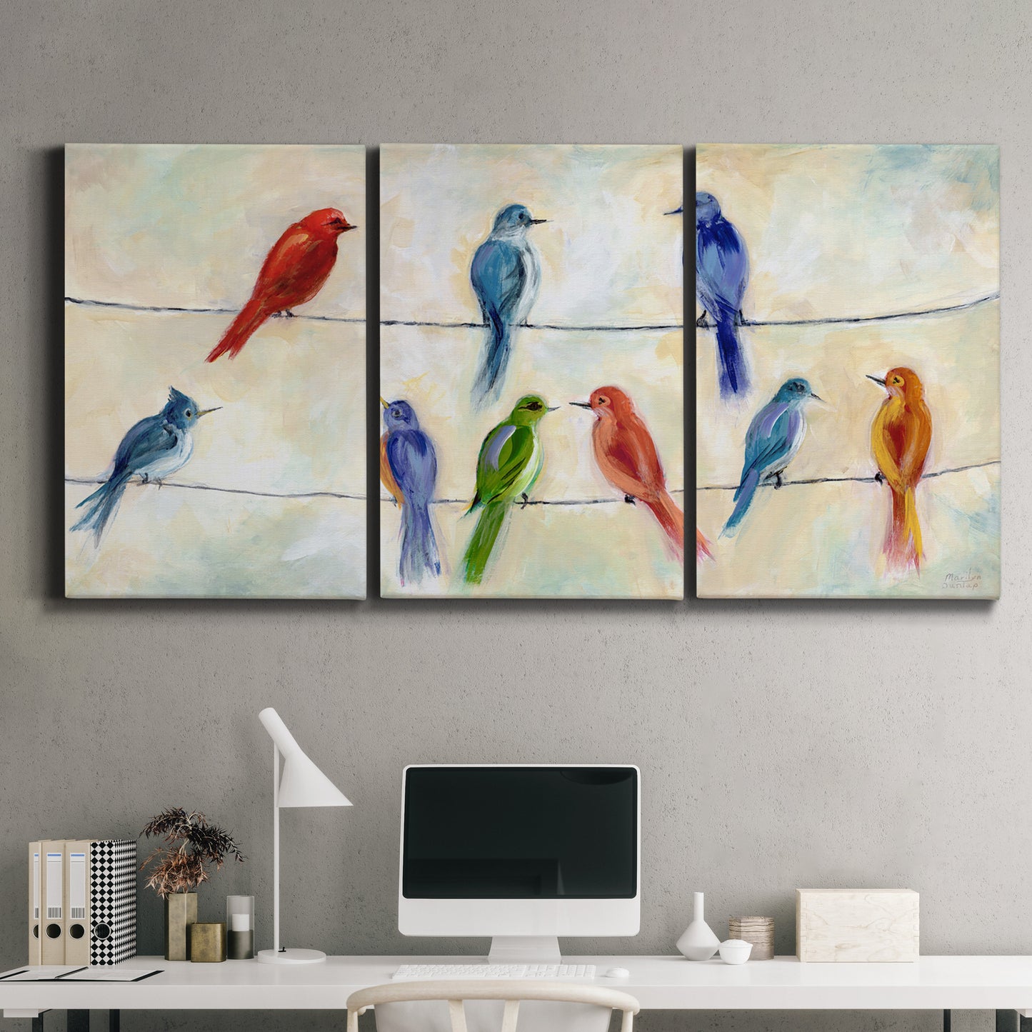 Three-panel canvas wall art featuring whimsical animal chatter illustration, displayed above a desk in a home office.