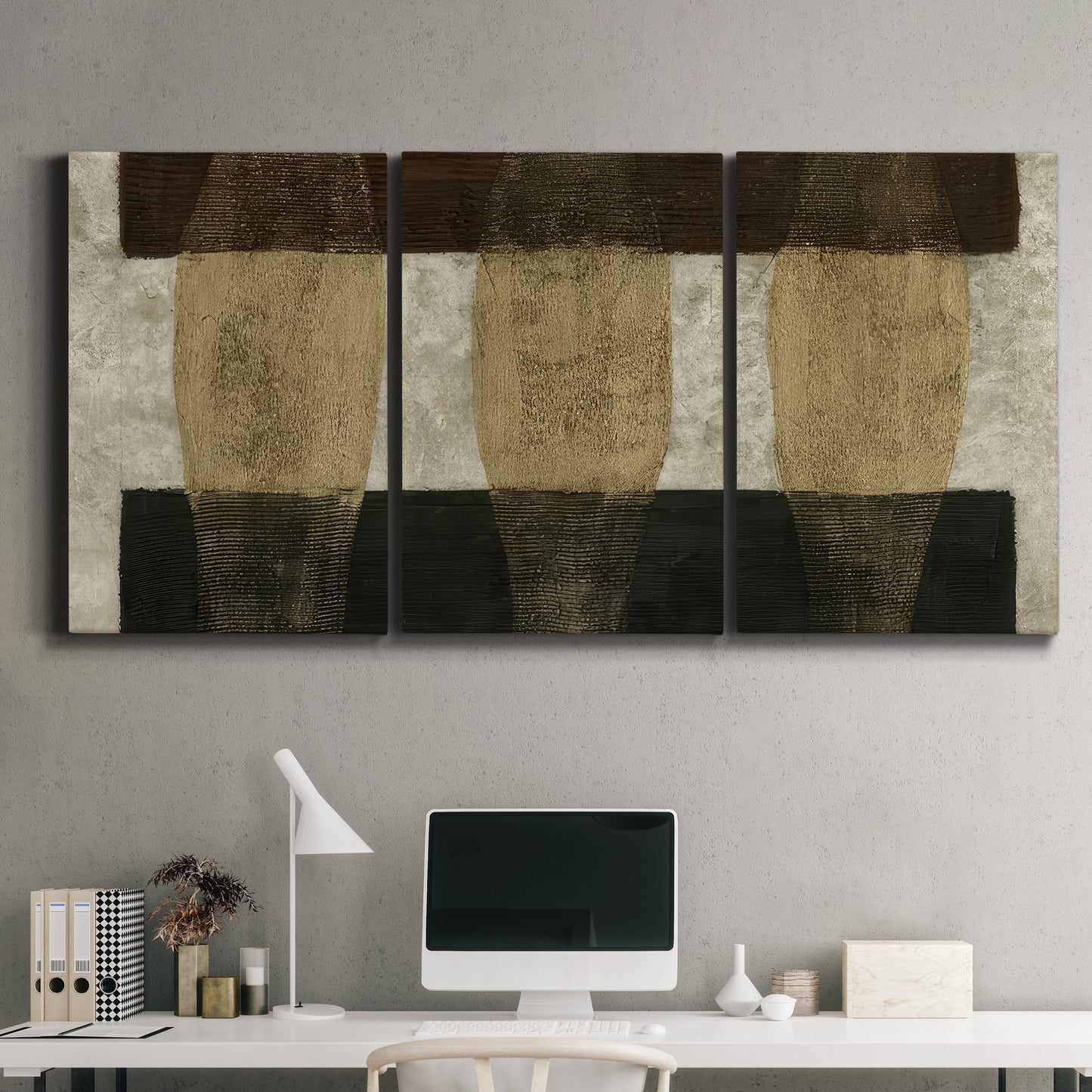 Three-panel canvas wall art featuring textured abstract vessel forms, displayed above a desk in a home office.