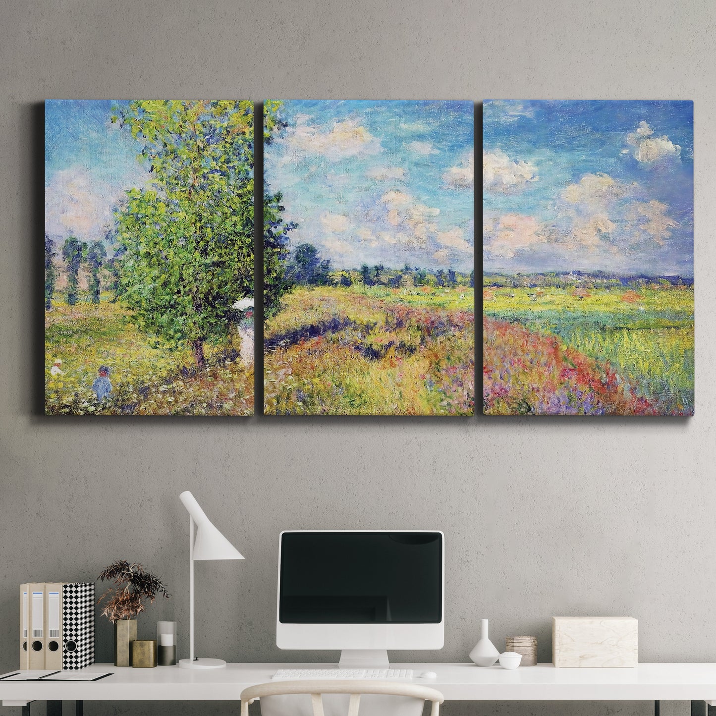 Three-panel canvas wall art featuring sunlit meadow landscape, displayed above a desk in a home office.