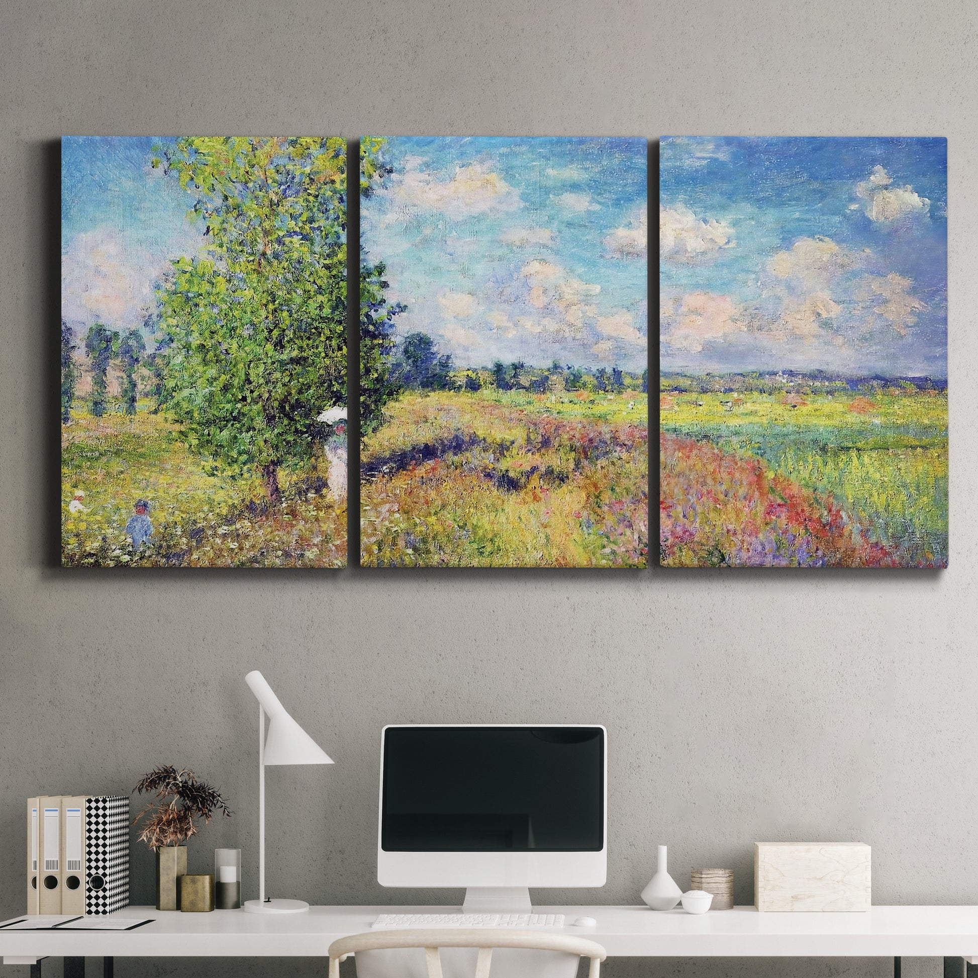 Three-panel canvas wall art featuring sunlit meadow landscape, displayed above a desk in a home office.