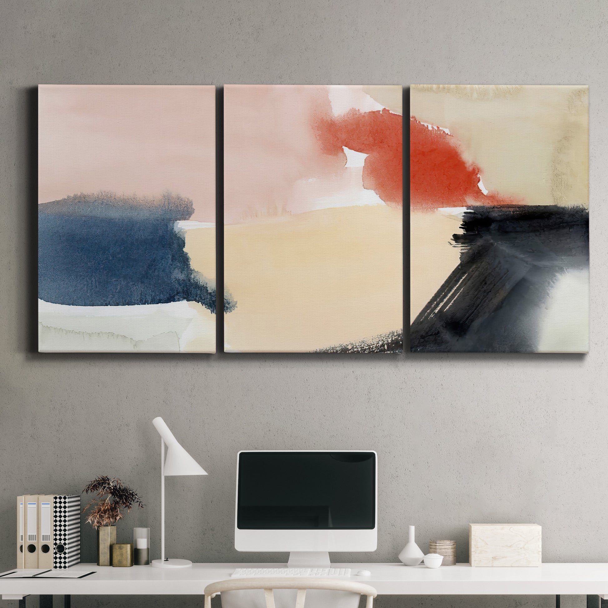 Three-panel canvas wall art featuring playful abstract watercolor shapes, displayed above a desk in a home office.