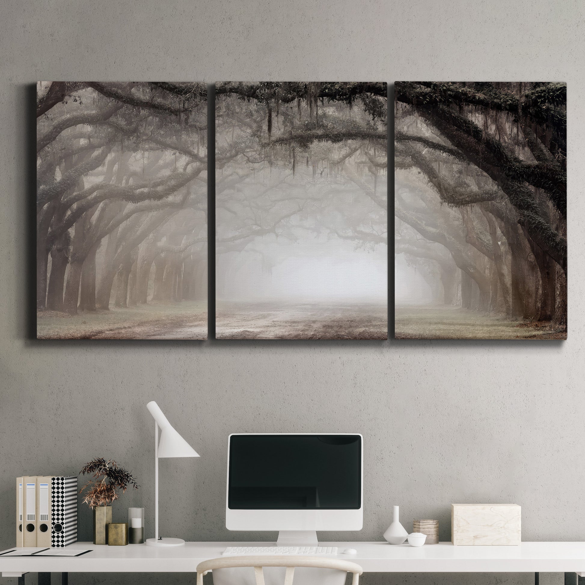 Three-panel canvas wall art featuring tree lined plantation road, displayed above a desk in a home office.
