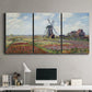 Three-panel canvas wall art featuring tulip fields with windmill, displayed above a desk in a home office.
