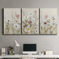 Three-panel canvas wall art featuring loose farmhouse style floral painting, displayed above a desk in a home office.