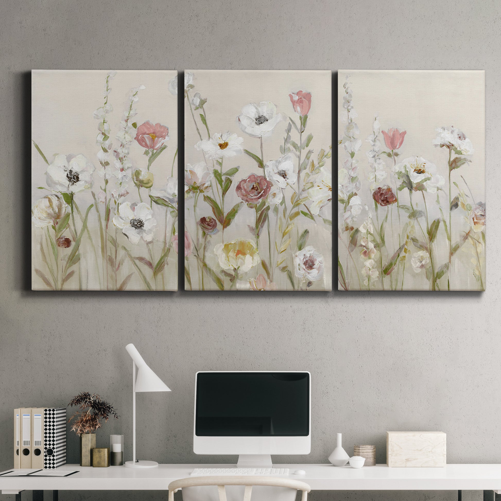 Three-panel canvas wall art featuring loose farmhouse style floral painting, displayed above a desk in a home office.