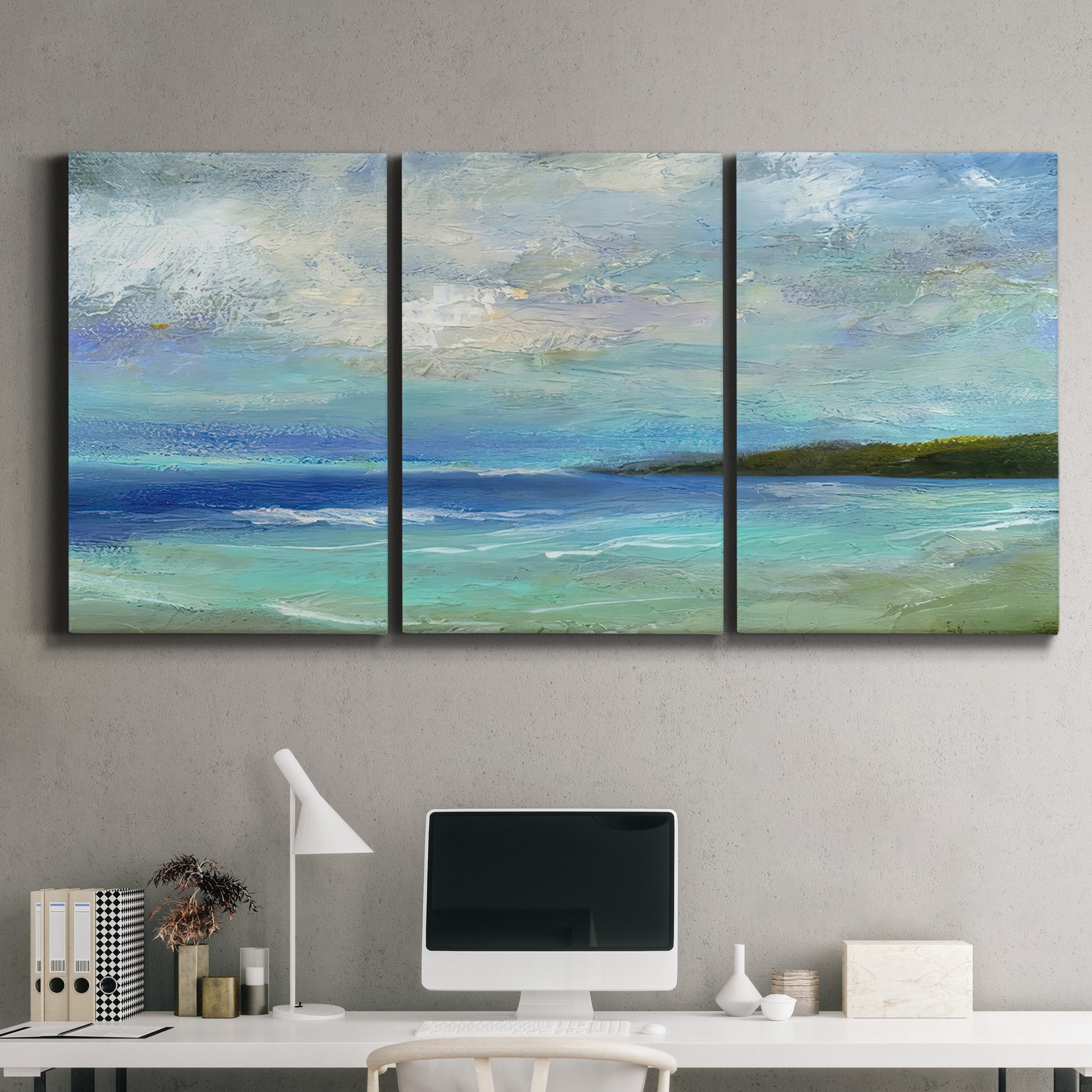 Three-panel canvas wall art featuring narrow island inlet waters, displayed above a desk in a home office.