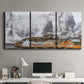 Three-panel canvas wall art featuring winter village street photography, displayed above a desk in a home office.