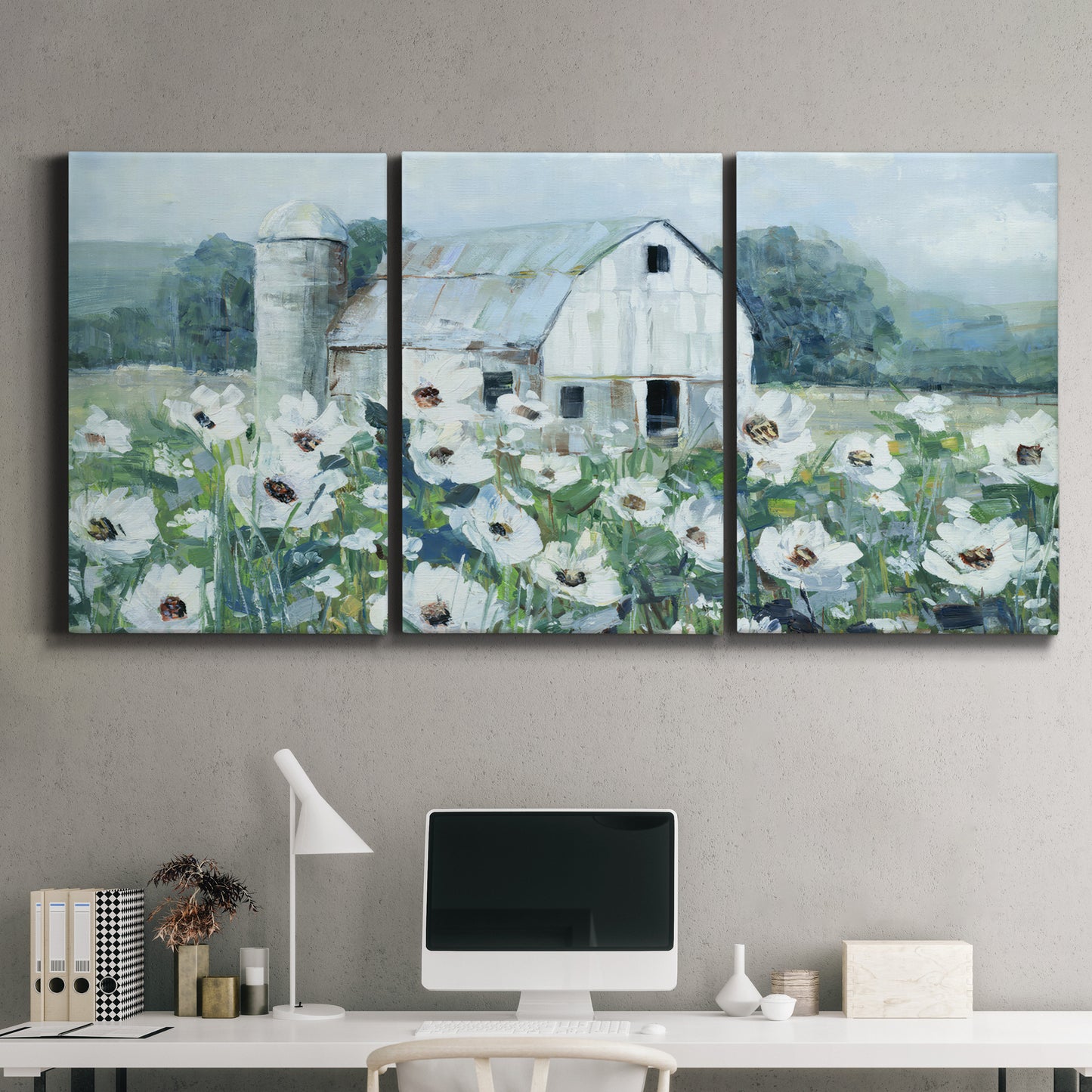 Three-panel canvas wall art featuring pastoral farmland with open fields, displayed above a desk in a home office.