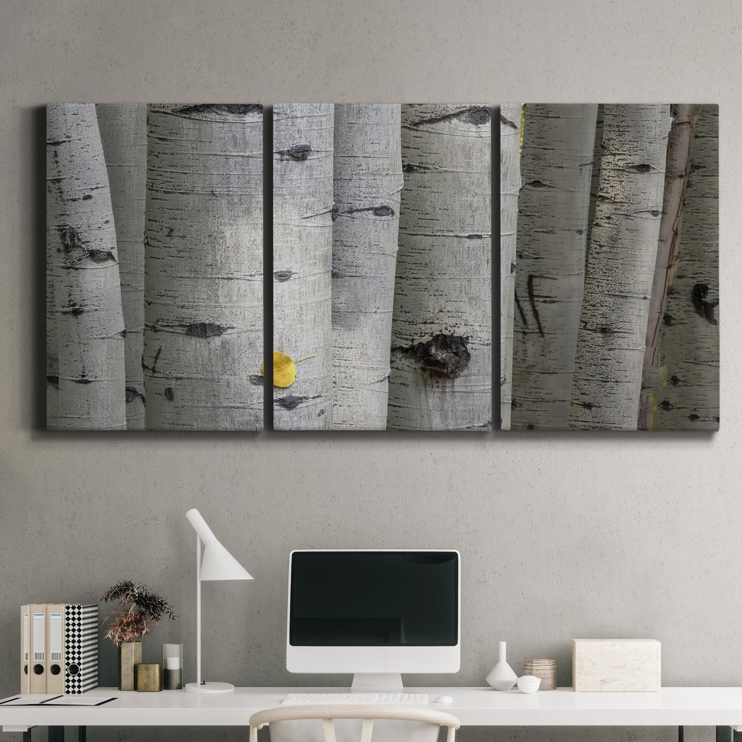 Three-panel canvas wall art featuring close up tree bark texture photograph, displayed above a desk in a home office.