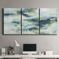Three-panel canvas wall art featuring dreamlike abstract drifting motion, displayed above a desk in a home office.