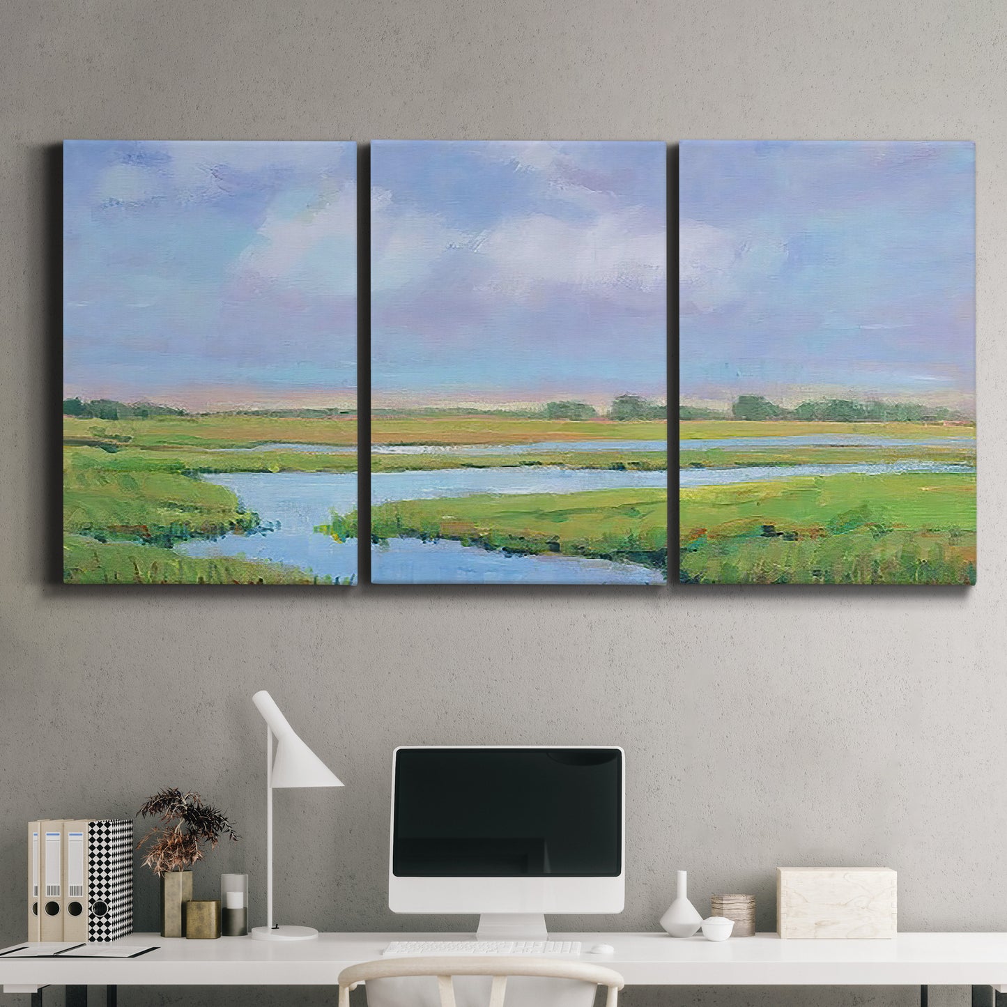 Three-panel canvas wall art featuring summer marshland with tall grasses, displayed above a desk in a home office.