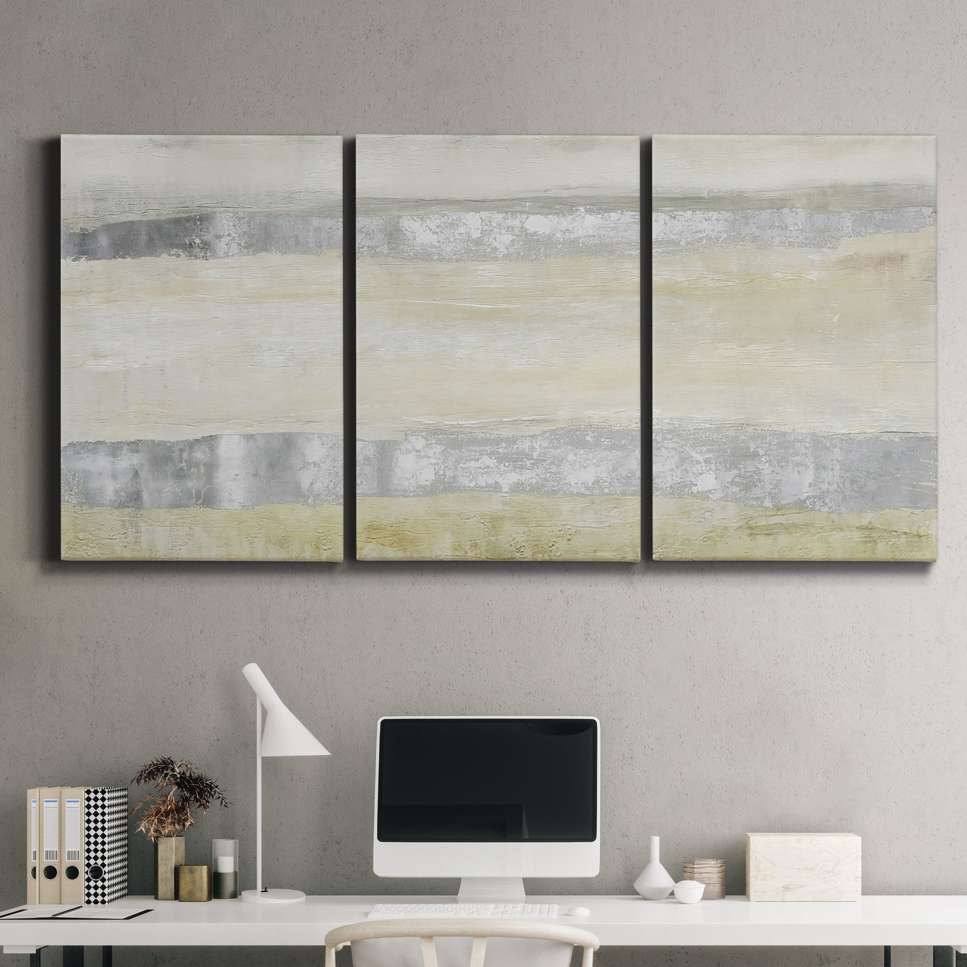 Three-panel canvas wall art featuring minimal abstract storm movement, displayed above a desk in a home office.