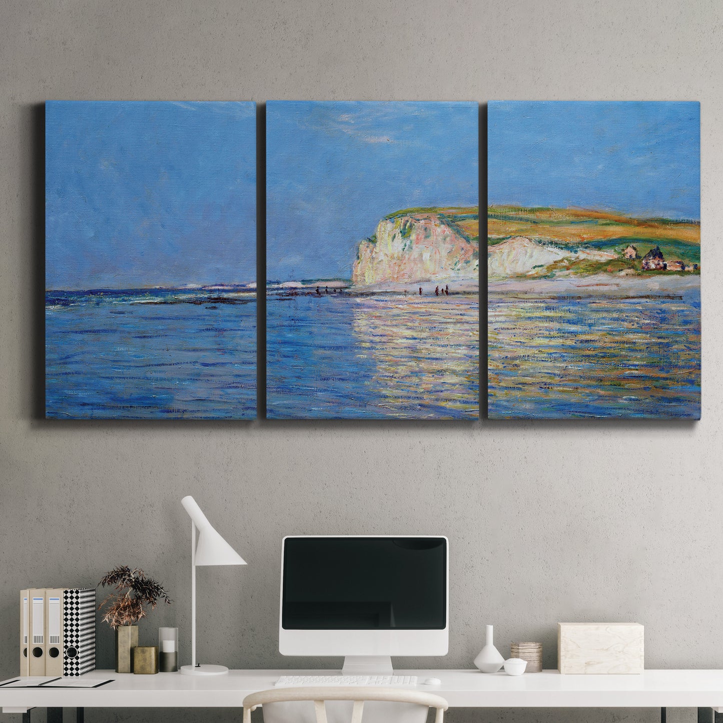 Three-panel canvas wall art featuring white cliffs rising above sea, displayed above a desk in a home office.