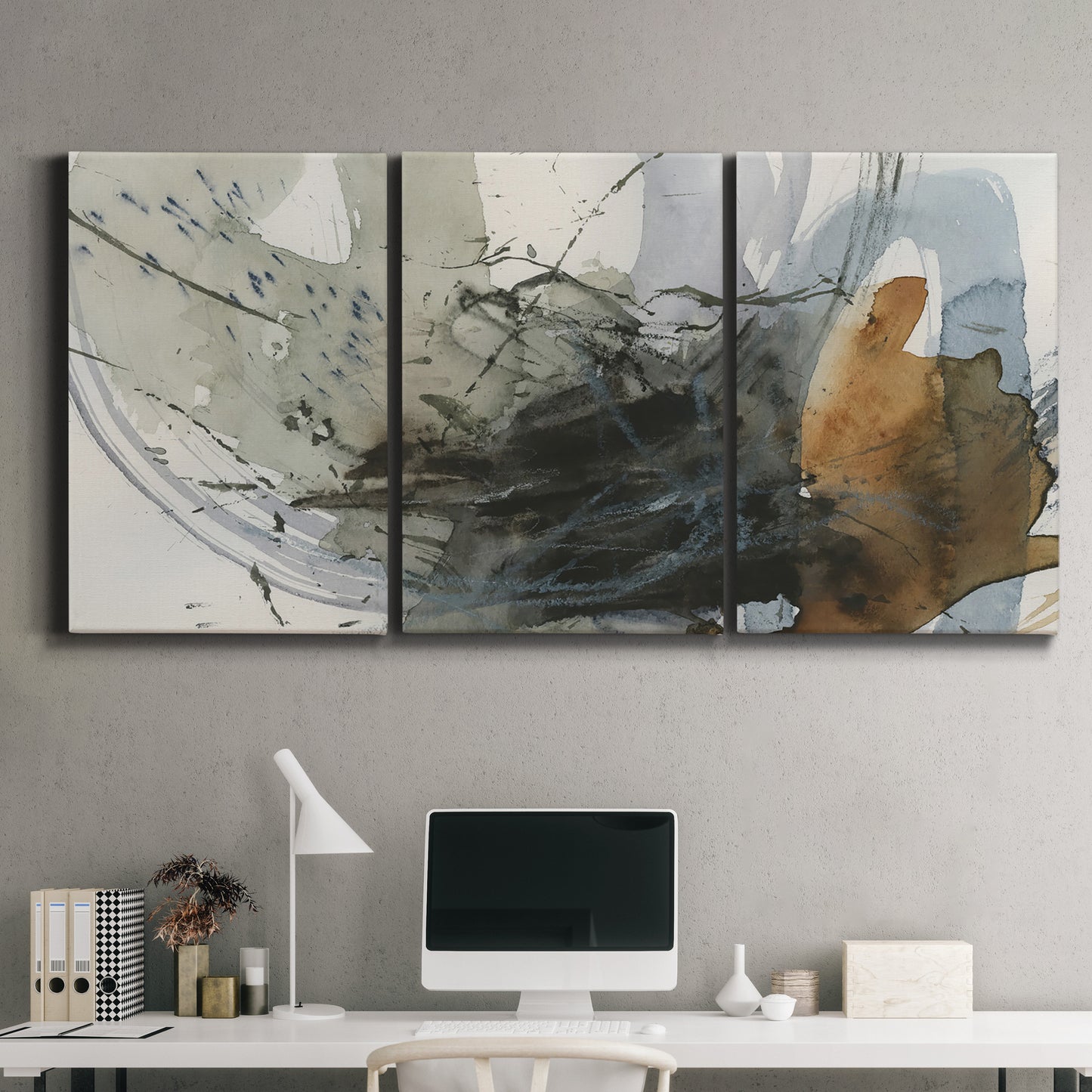 Three-panel canvas wall art featuring dynamic circular abstract motion, displayed above a desk in a home office.