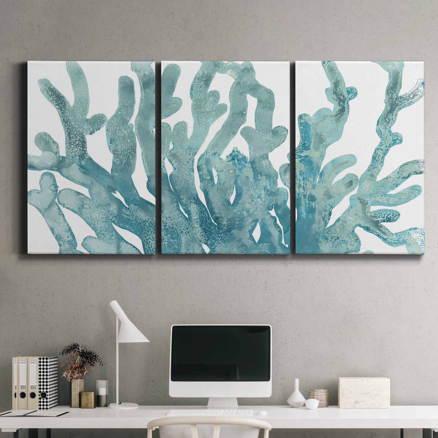 Three-panel canvas wall art featuring blue coral inspired watercolor, displayed above a desk in a home office.