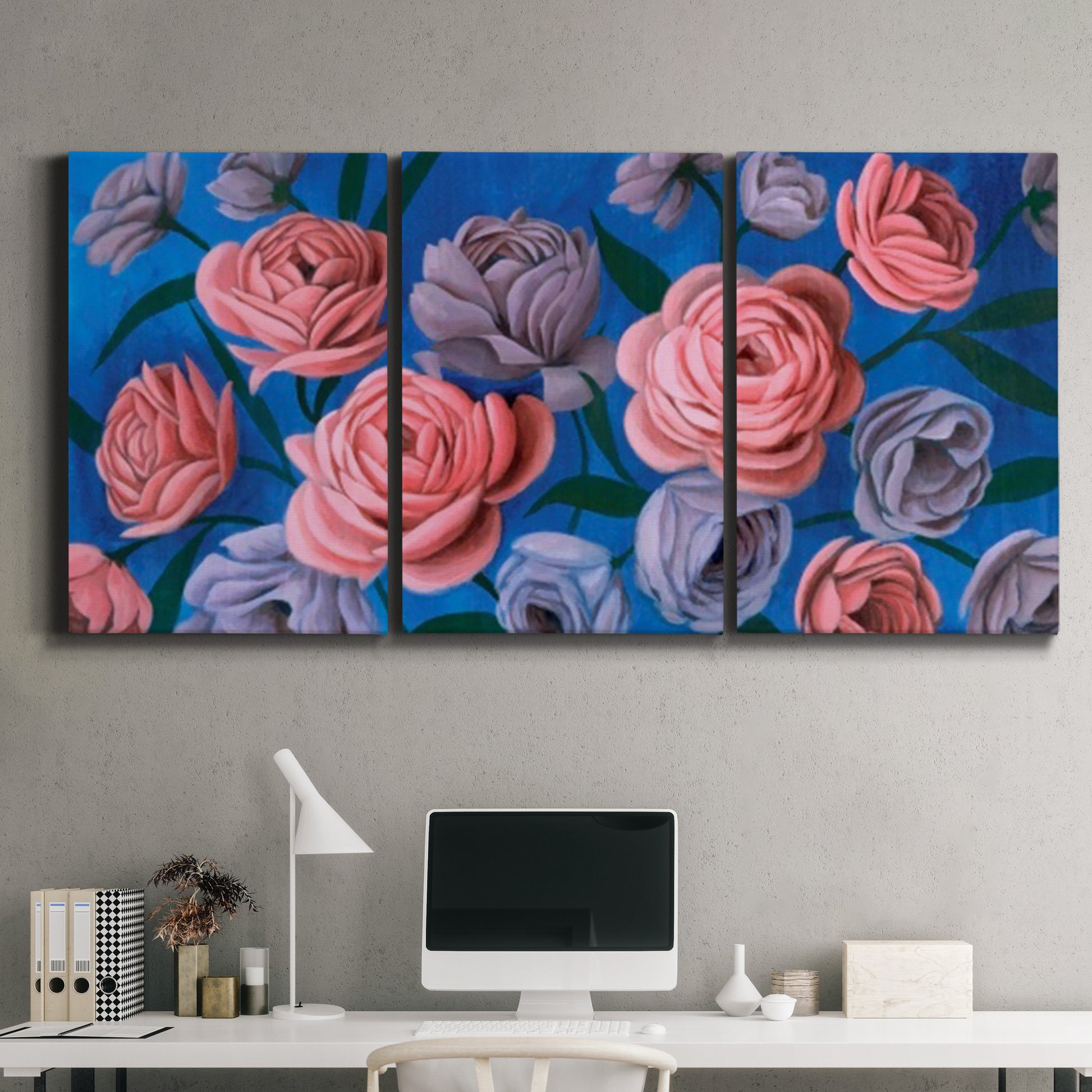Three-panel canvas wall art featuring layered botanical petal abstractions, displayed above a desk in a home office.