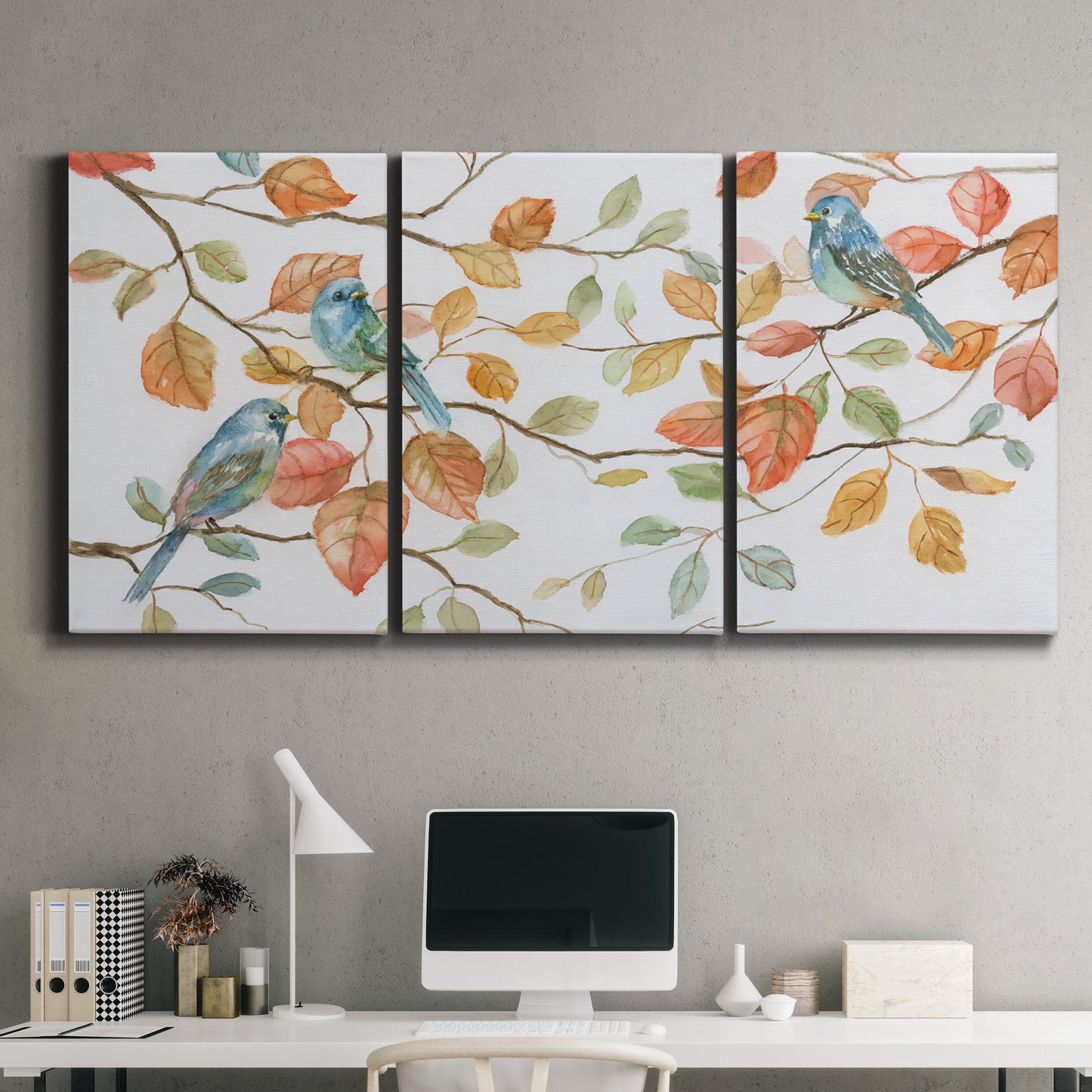 Three-panel canvas wall art featuring decorative bird trio illustration, displayed above a desk in a home office.