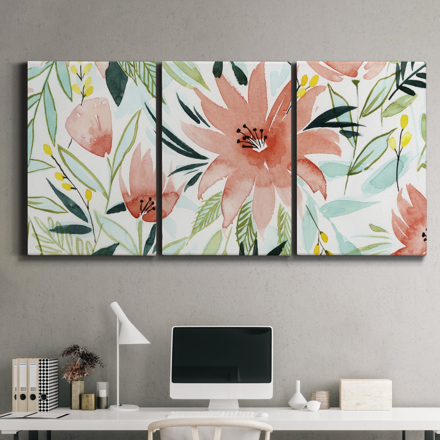 Three-panel canvas wall art featuring tropical botanical collage, displayed above a desk in a home office.