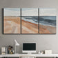 Three-panel canvas wall art featuring abstract coastal beach composition, displayed above a desk in a home office.