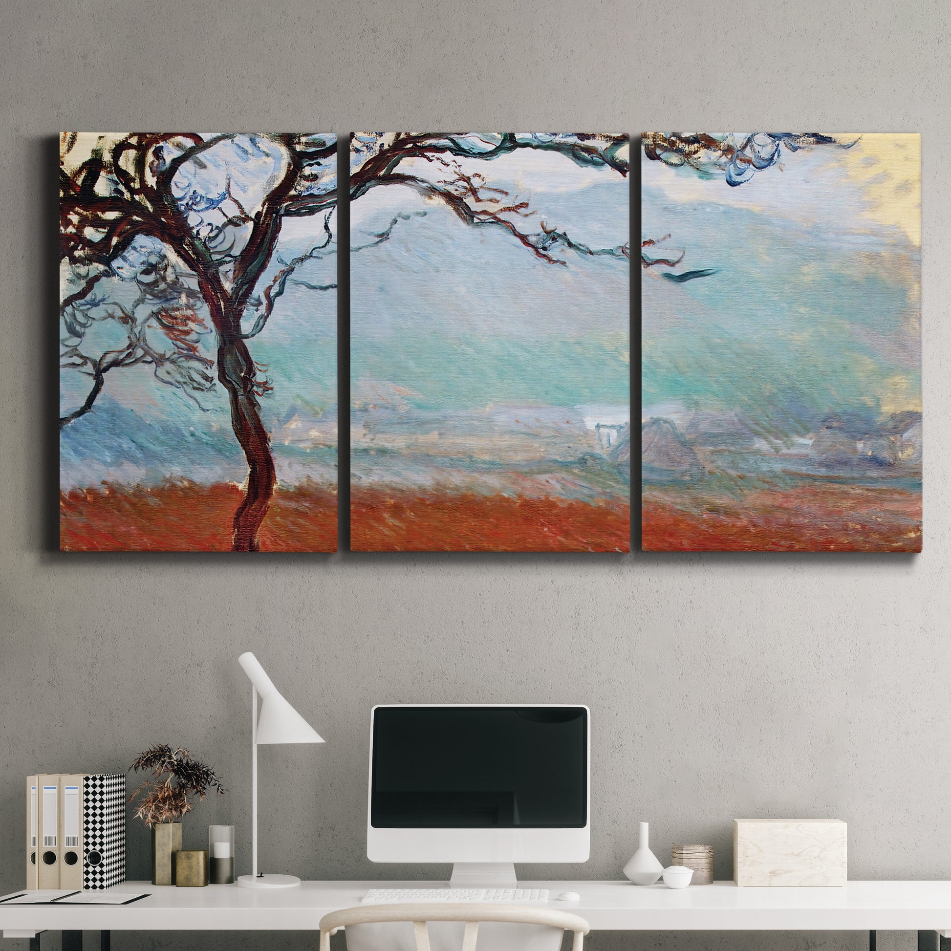 Three-panel canvas wall art featuring coastal trees at evening light, displayed above a desk in a home office.