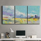 Three-panel canvas wall art featuring open landscape suggesting distant journey, displayed above a desk in a home office.