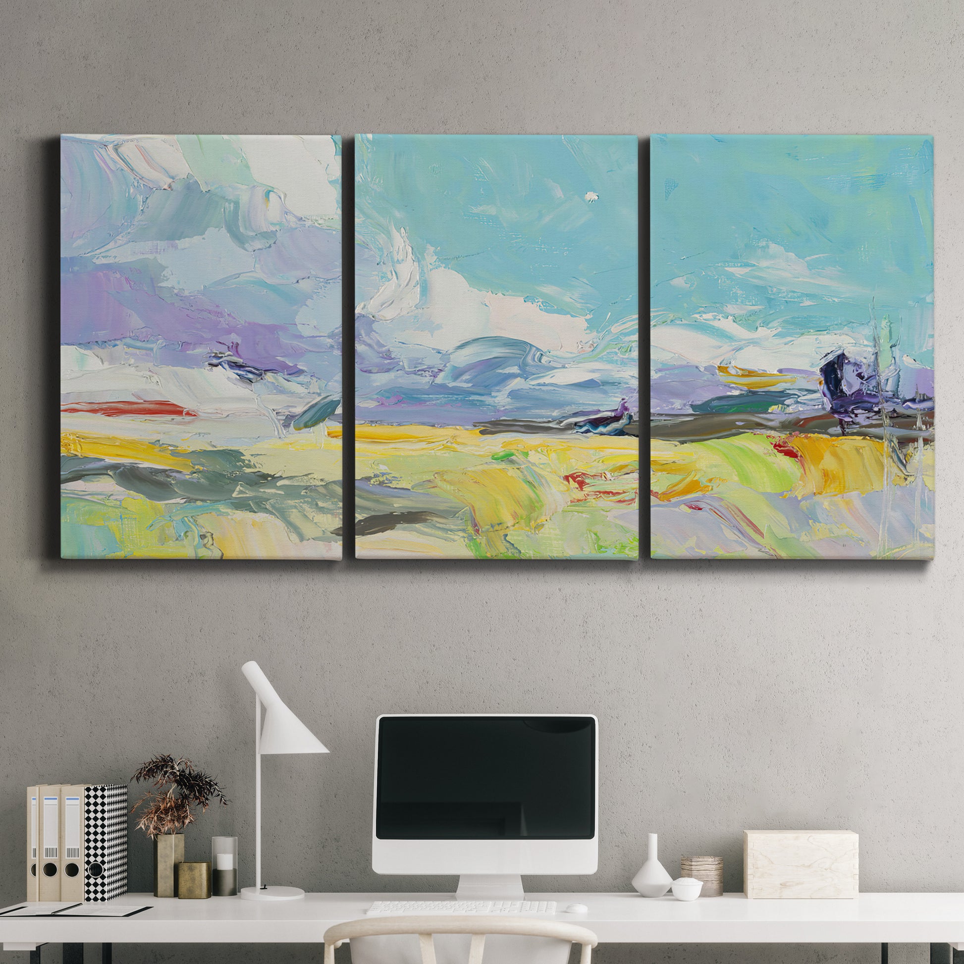 Three-panel canvas wall art featuring open landscape suggesting distant journey, displayed above a desk in a home office.