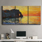 Three-panel canvas wall art featuring arched coastal cliff above sea, displayed above a desk in a home office.