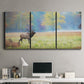 Three-panel canvas wall art featuring resting animals in open field, displayed above a desk in a home office.