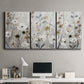 Three-panel canvas wall art featuring misty wildflower meadow landscape, displayed above a desk in a home office.