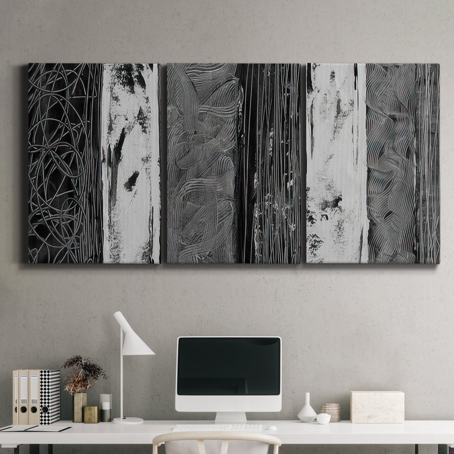 Three-panel canvas wall art featuring brushed metallic abstract textures, displayed above a desk in a home office.