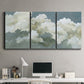 Three-panel canvas wall art featuring abstract evening landscape with depth, displayed above a desk in a home office.