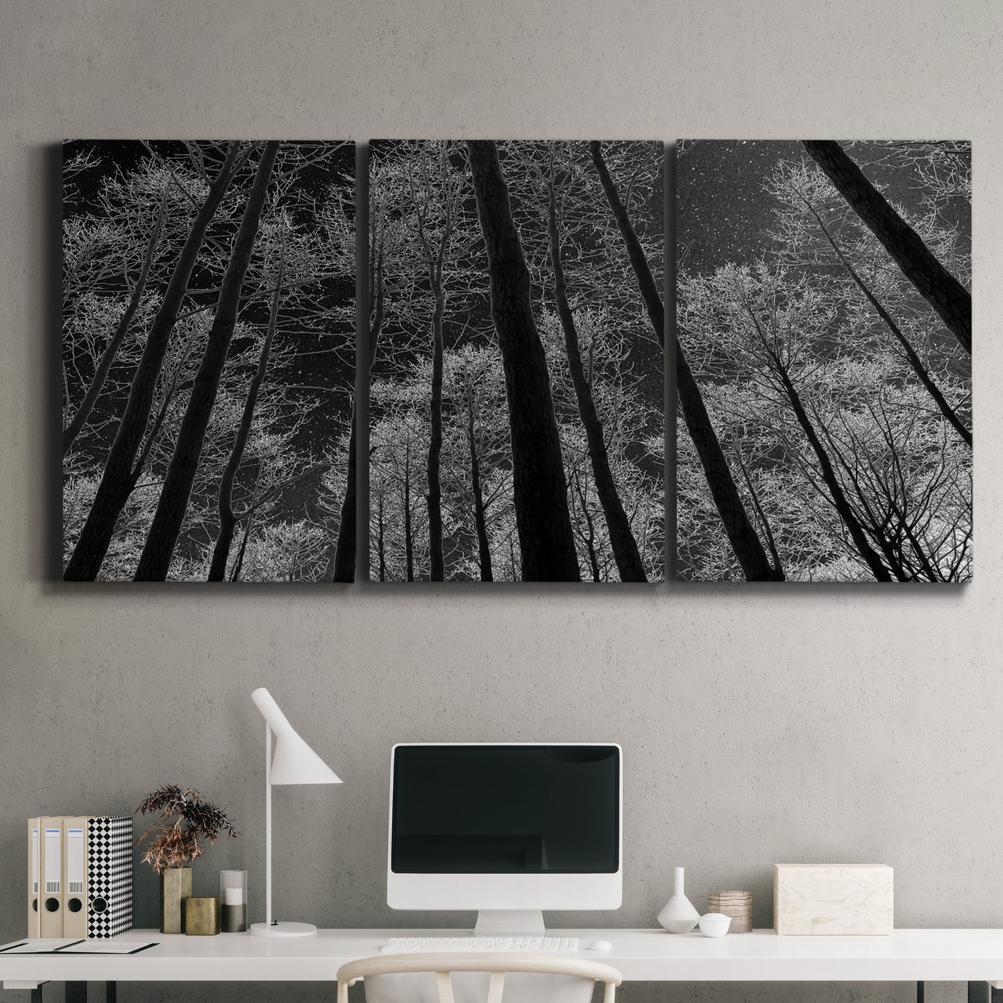 Three-panel canvas wall art featuring riverside houses along canal, displayed above a desk in a home office.